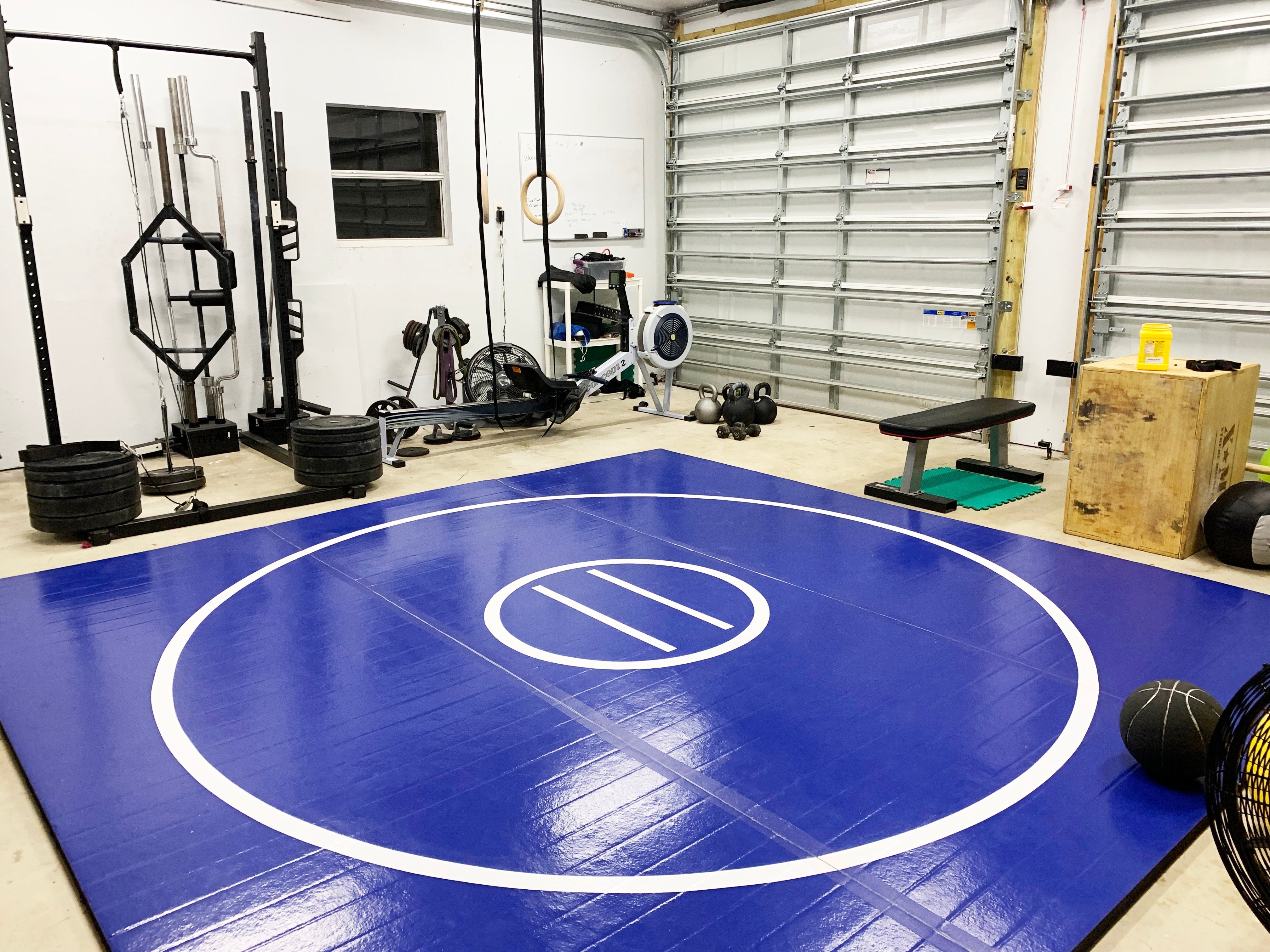 Blue Easy Roll Up Wrestling Mat in Home Garage Gym