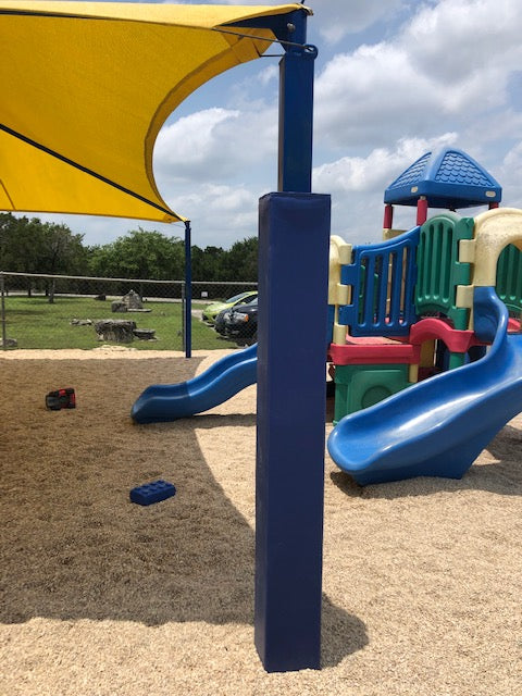 Blue pole pad on a playground umbrella shade
