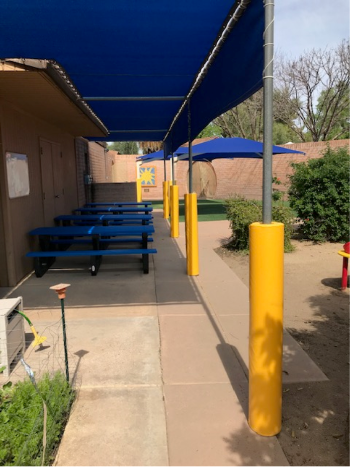 Yellow Safety Pole Pads at Elementary Playground