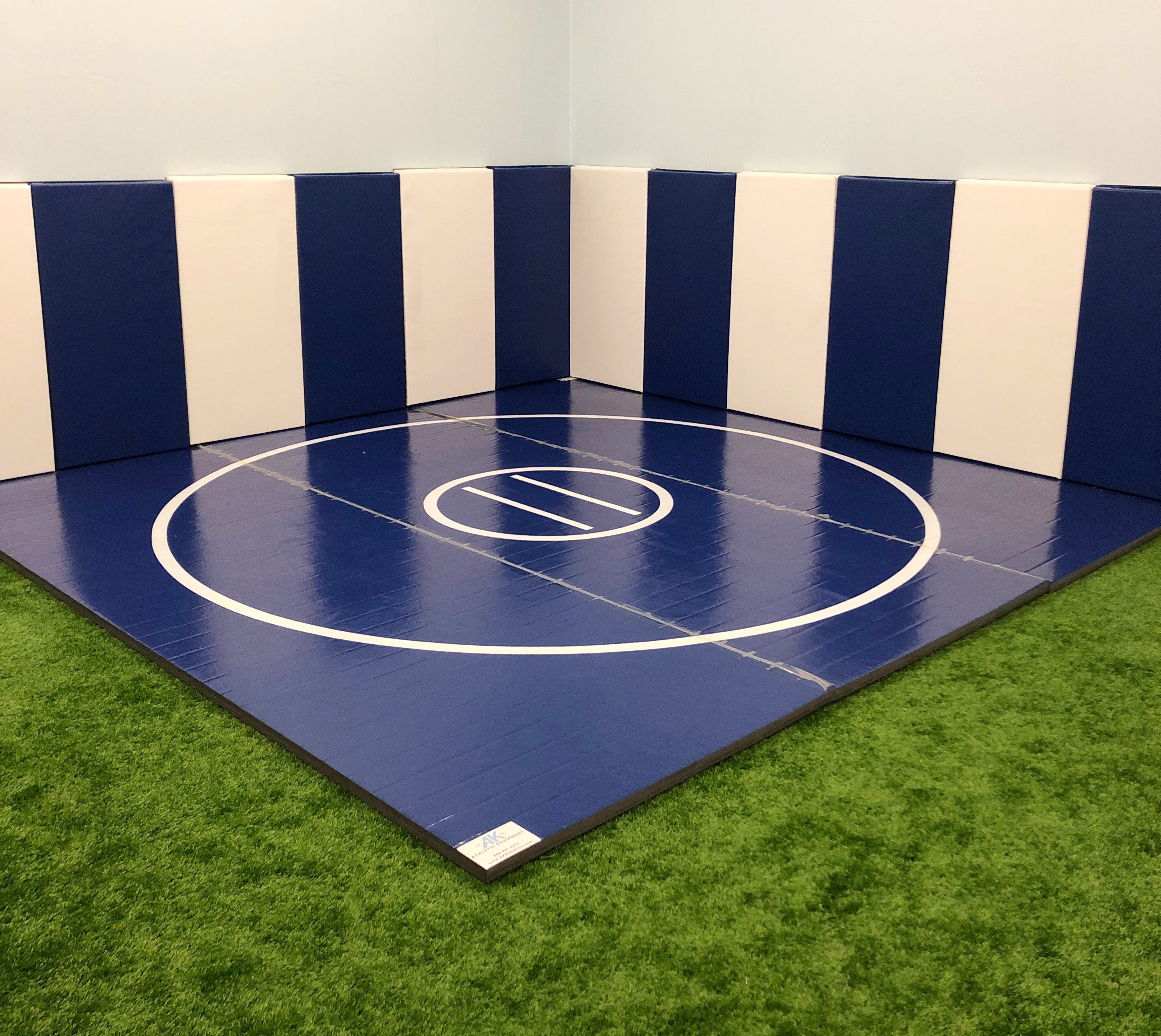 Training Wrestling Mat in Corner With Protective Wall Padding. Customize the size and look with digitally printed wrestling mats. 