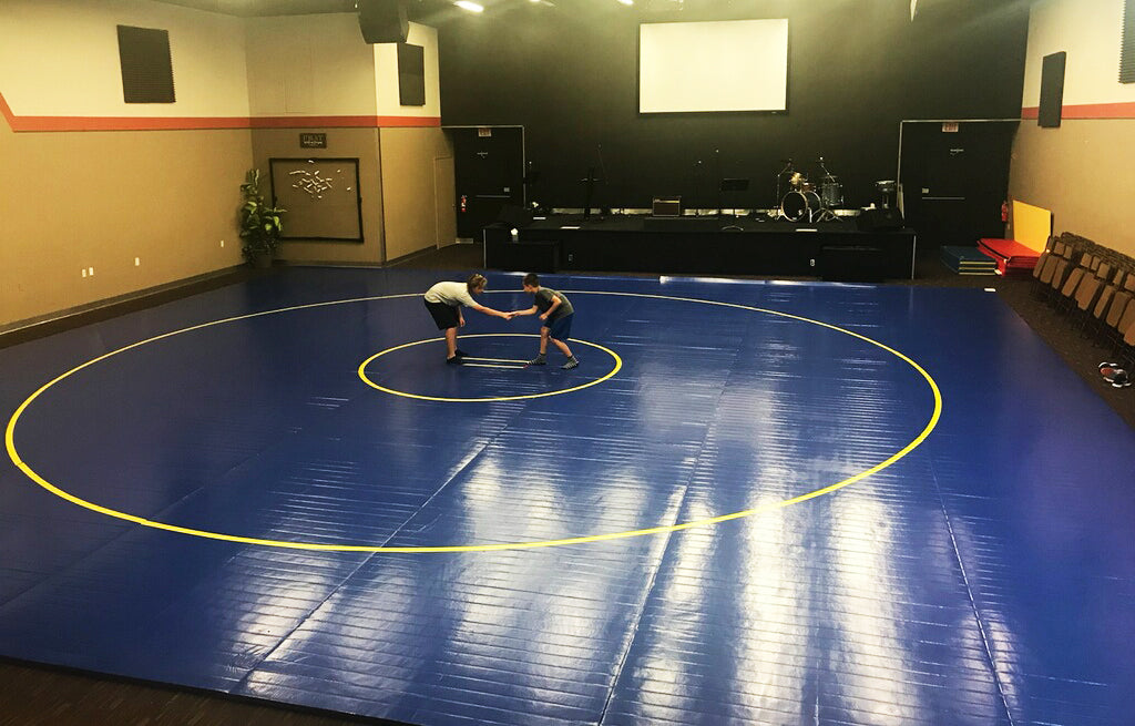 Large Competition Wrestling Mat Blue With Yellow Circles - NCAA. AK Athletic Equipment mats are perfect for family, personal and competitive use. 