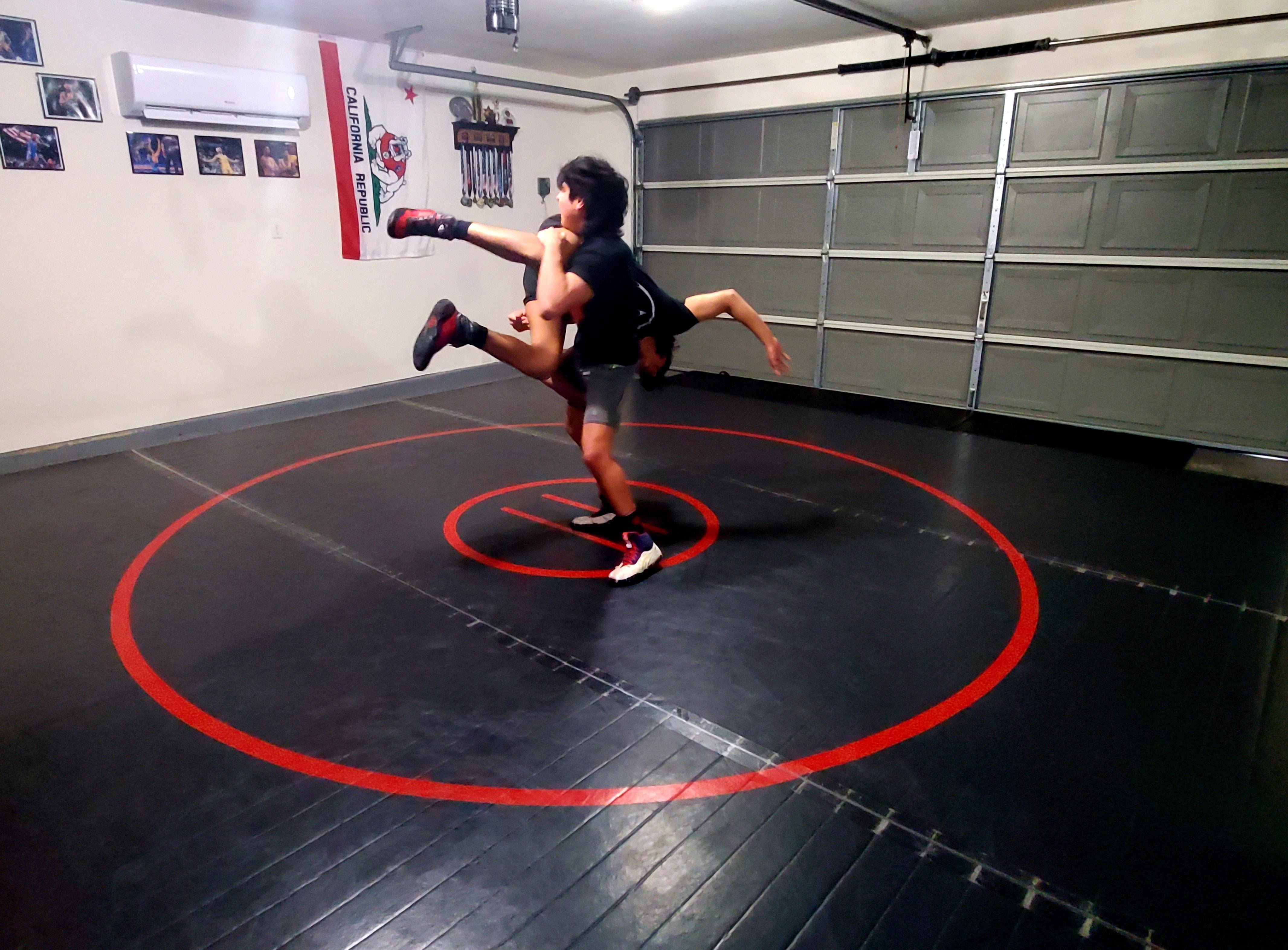 Black and Red Smooth, Easy to Clean Wrestling Mat in Home Garage Gym