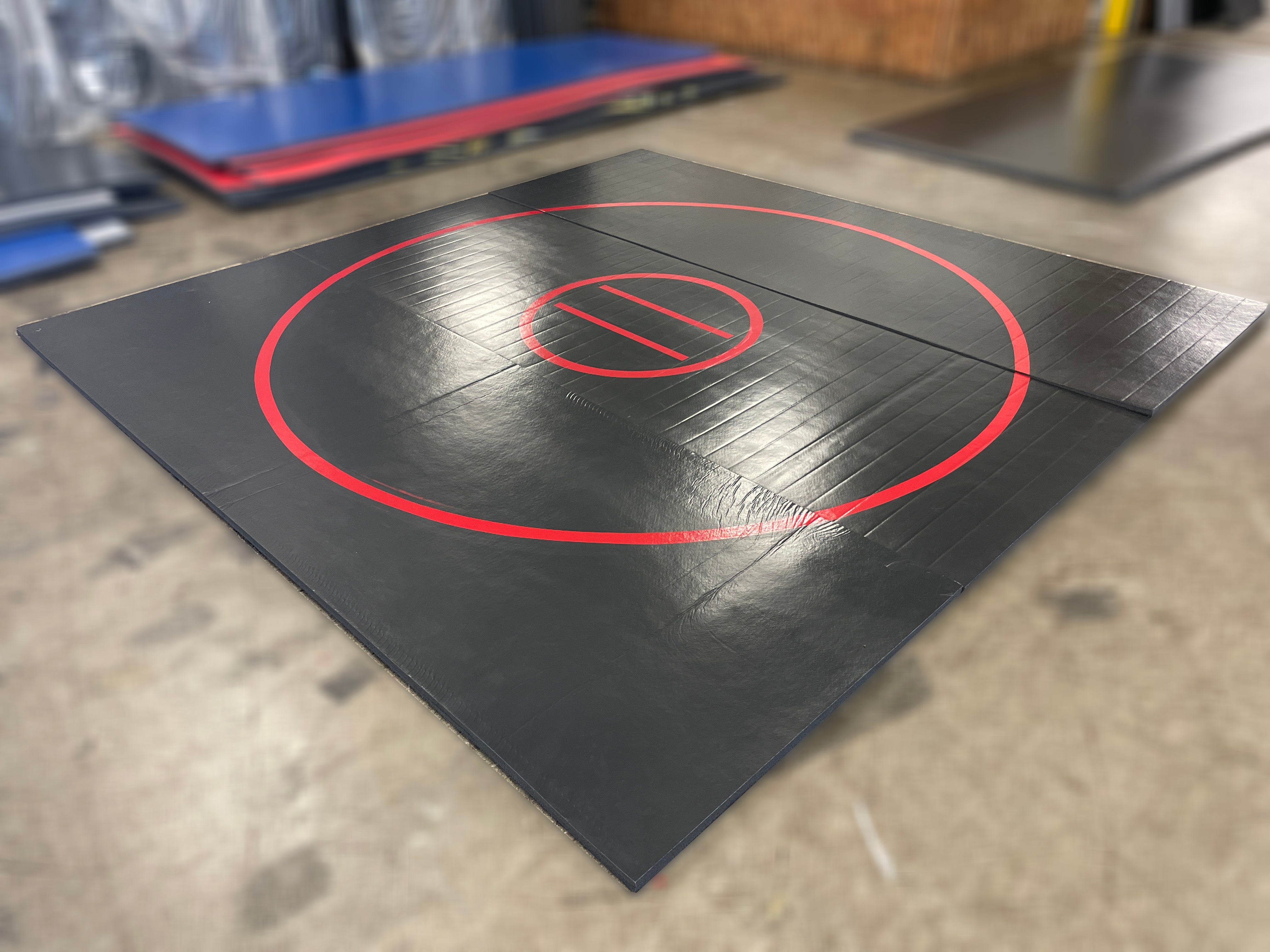 Clearance Wrestling Mat 12' x 12' x 1 3/8" Roll-Up Mat Black with Red Circles
