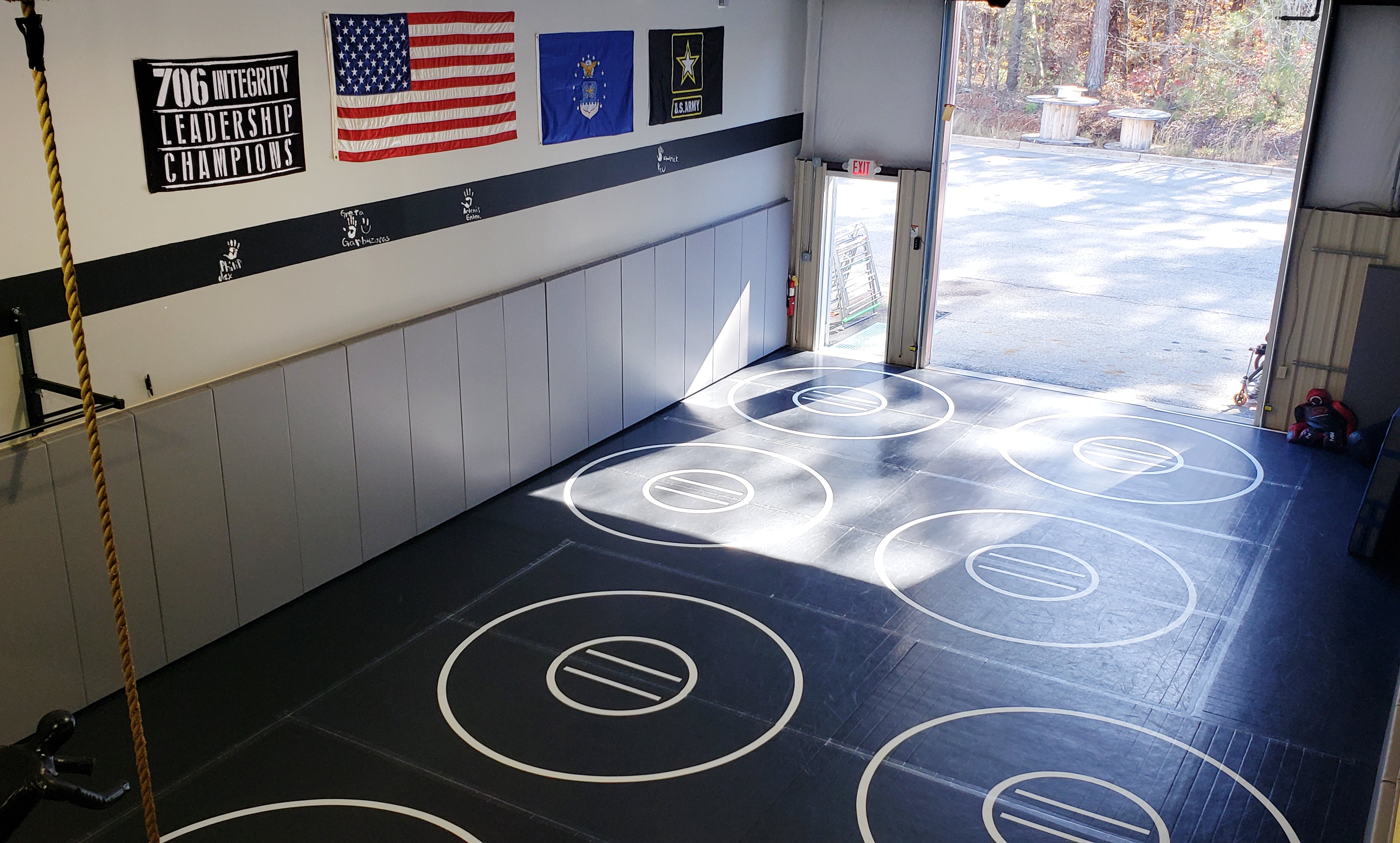 Wrestling Training Room with Multiple Practice Circle Wrestling Mats and Wall Safety Mats Made in the USA 